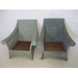 A pair of Lloyd Loom style arm chairs - no cushions