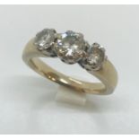 A substantial unmarked white gold ( tested as 18ct) diamond three stone ring of approximately 1ct