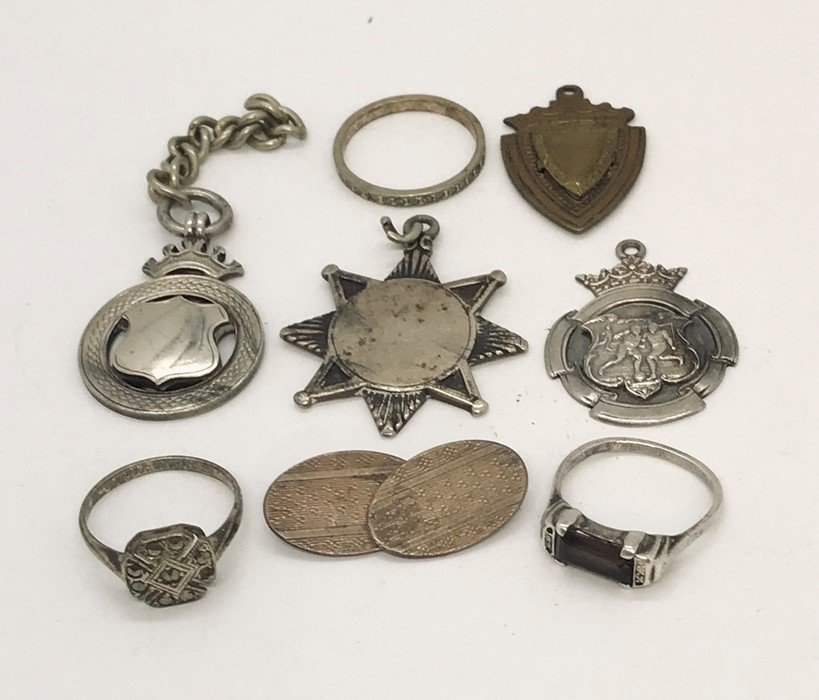 A small collection of silver jewellery, medallions etc.