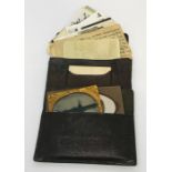 A leather wallet containing various cabinet style photographs etc. including WWI soldiers, a