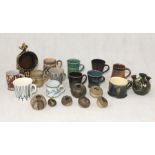A collection of studio pottery style mugs etc