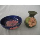 A Moorcroft bowl along with a green ground Moorcroft vase