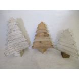 A collection of three handmade wooden Christmas trees