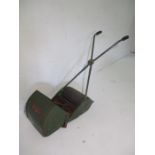 A vintage Webb push along lawnmower