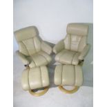 A pair of Stressless style reclining armchairs with matching footstools