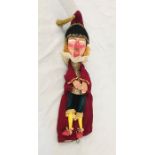 A vintage Punch and Judy "Punch" puppet by Chris Whitehouse with wooden head, hands, legs and feet.