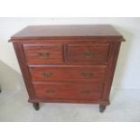 A satin wood chest of four drawers