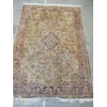 A beige ground rug - 260cm x 181cm