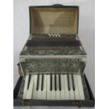 A vintage cased Vissimio accordian