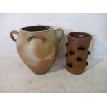 A four handled glazed pottery urn, along with strawberry forcer