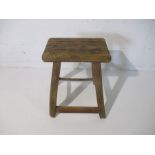 A rustic elm stool