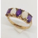 A 9ct gold ring with opals and amethysts
