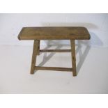 A rustic elm stool