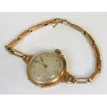 A Victorian ladies 9ct gold wristwatch on 9ct gold strap- total weight ( including movement 23.9g)