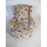 A re-upholstered Victorian armchair