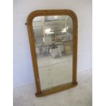 A Victorian over-mantle pine mirror