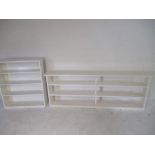 A white painted bookcase along with one other