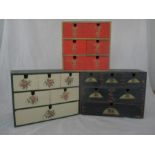 Three sets of wooden drawers with hand painted decoration