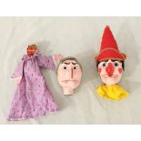 A paper mache set of Punch and Judy heads along with the Baby