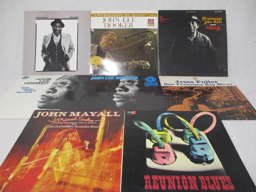 A collection of eight vintage blues 12" vinyl records including John Lee Hooker, Muddy Waters, Jesse