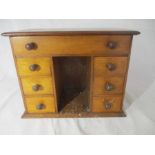 A miniature oak sewing box in the form of a kneehole desk, 35cm x 27cm x 20cm