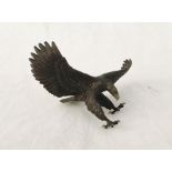 A bronze figure of an eagle in flight- damage to underside of tail where mount should be, wingspan