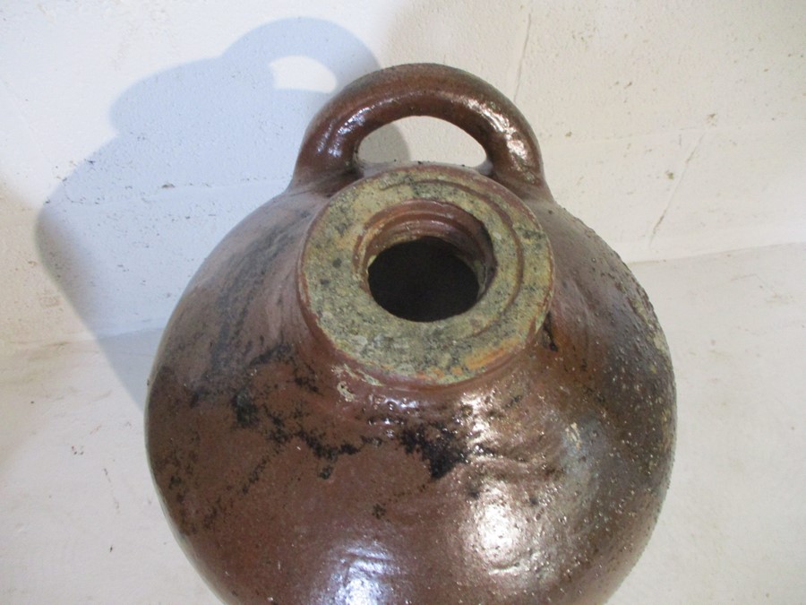 A large two handled glazed terracotta urn along with a large flagon - Image 9 of 11