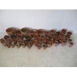 A large collection of terracotta garden pots