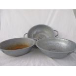 Three shallow galvanised two handled dishes