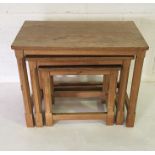 A Robert "Mouseman" Thompson nest of three tables all with a mouse carved into a leg