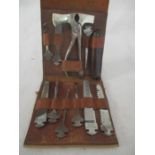 A vintage German "Bonsa" tool kit marked D.R.G.M. in original leather case. Attachments include,