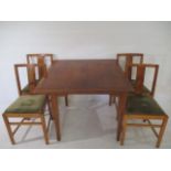 A drawleaf table with four chairs