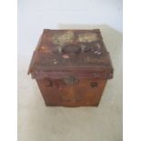 A leather hat box (A/F) containing an African style mask, papier-mache figures etc
