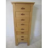 A contemporary chest of eight drawers.