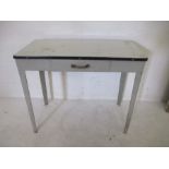 A vintage enamelled top metal side table with one drawer