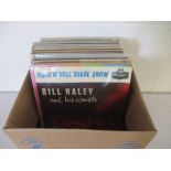A collection of mainly 1960's 12" vinyl records including Elvis Presley, Eddie Cochran, The Moody