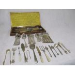 A cased silver mounted four piece horn handled carving set with a collection of silver plated