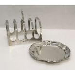 A hallmarked silver toast rack along with a silver pin dish