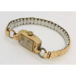 A ladies 9ct gold Rotary watch on base metal expandable strap