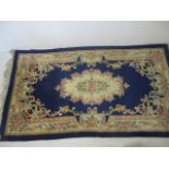 A Chinese blue ground rug. 210cm x 122cm