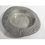 A Liberty pewter dish marked to underside 0202 decorated with foliage