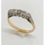 An 18ct gold ring with diamonds set in platinum