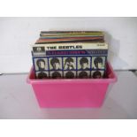 A collection of 12" vinyl records including The Beatles, Joan Baez, Elton John, Beach Boys, Diana