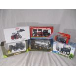 A collection of five boxed farming related die-cast models including a Universal Hobbies Joskin