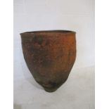 A large terracotta olive jar - A/F (Height 72cm)