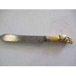 A carving knife by Harvey & Gore, London. The ivory handle carved with animals