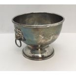 A hallmarked silver bowl with lions head handles, weight 99g