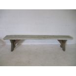 A white painted rustic wooden bench