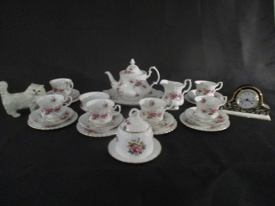 A part Royal Albert "Lavender Rose" tea set ( 1 cup cracked) along with a Worcester clock and a