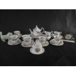 A part Royal Albert "Lavender Rose" tea set ( 1 cup cracked) along with a Worcester clock and a